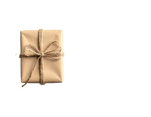 A single, square gift wrapped in brown paper and tied with twine against a black background