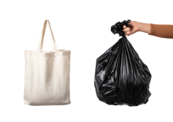 Tote bag and garbage bag held in hand against black background