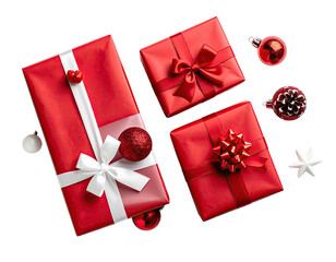 Overhead view of Christmas gifts wrapped in red paper, ribbons, and decorative ornaments on black