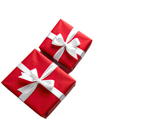 Two red wrapped gifts with white ribbons sit diagonally, against a black background