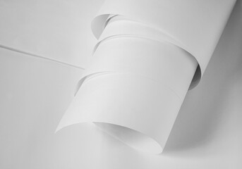 A roll of white paper in black and white.