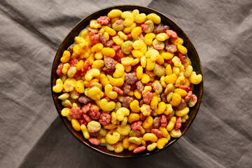 Fruity Kids Breakfast Cereal with Milk in a Bowl, top view.