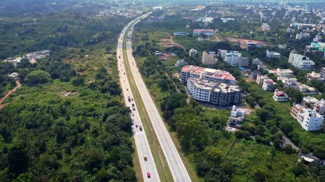 Ariel Shot of beautiful Bangalore City in India with nice road highway connecting Mysore passingby in Karnataka, India