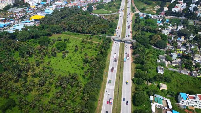 Ariel Shot of beautiful Bangalore City in India with nice road highway connecting Mysore passingby in Karnataka, India