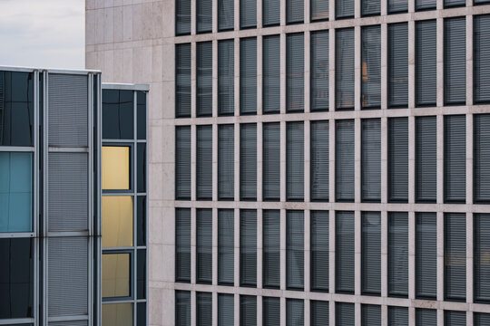 Contemporary glass tower with layered facade and vertical rhythm, emphasizing modern design language, transparency, and balance between reflection and light in architectural aesthetics