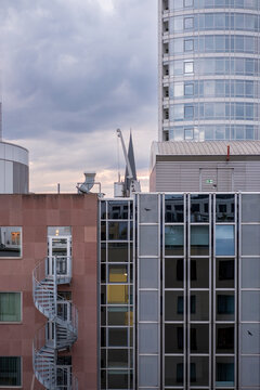 Facade of modern residential building with horizontal lines and rhythmical windows, emphasizing balance and light, representing urban clarity and minimalist architectural order