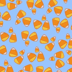 Seamless pattern of illustrated candy corn on a light blue background
