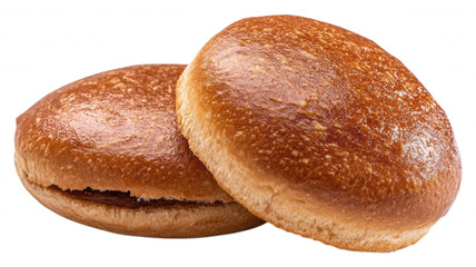 Two shiny burger buns stacked on a black background close up
