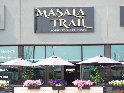 Stittsville,ON, Canada, June 22, 2025:A close-up of the modern storefront for a restaurant named "Masala Trail" at 5754 Hazeldean Rd #3.
