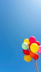 Fototapeta premium Vibrant balloons float serenely against a vast, clear blue sky on a bright, sunny day, colorful, blue sky, horizon