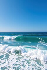 Obraz premium Vast ocean waves meet a clear, bright blue sky in a serene coastal landscape, tranquil, cloudless