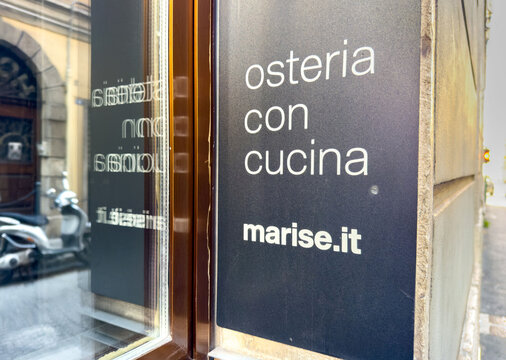 Trieste, Italy - October 14, 2025: Restaurant sign for Osteria con Cucina, featuring marise.it, showcasing a charming Italian dining experience in a historic urban setting