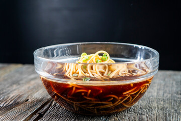 Noodles in soy sauce and beef. Pasta. Chinese cuisine. Food concepts.