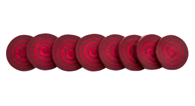 Beetroot slices are arranged horizontally, displaying their concentric rings against a isolated background.