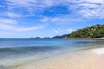 Seychelles Islands beach with villas on lush hill