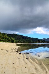 Seychelles island beach with dramatic cloud formations