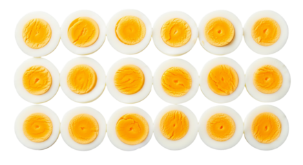 Boiled egg halves are arranged neatly in three rows with bright yellow yolks, set against a plain .