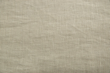 Fototapeta premium Close up view of oatmeal linen woven fabric. Quality natural textile texture ideal for backgrounds or design