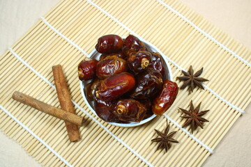 Sweet dried dates on bamboo mat