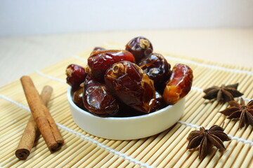 Sweet dried dates on bamboo mat