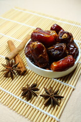 Sweet dried dates on bamboo mat