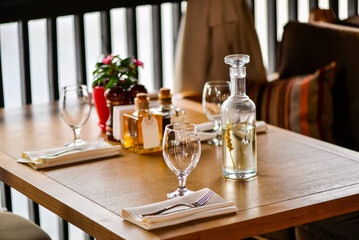 served brown table with a flower pot in a restaurant