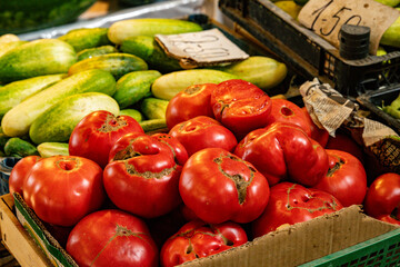 Fresh Red Tomatoes And Green Cucumbers On Market Stall In Kutaisi Georgia Symbolizing Local Farming And Natural Food Tradition