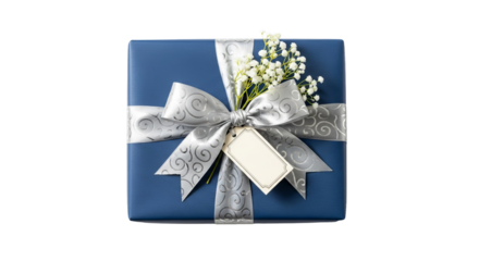 Gift box is wrapped in blue paper and decorated with silver ribbon, baby's breath and a tag.