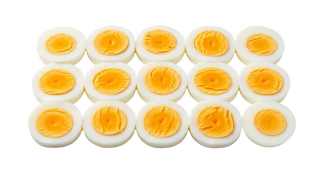 Hard boiled eggs are sliced and arranged in rows on a background. - high quality Hard boiled eggs are sliced and arranged in rows on a background.