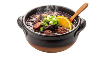 Hot bean stew fills a pottery bowl topped with green onions and an orange slice!