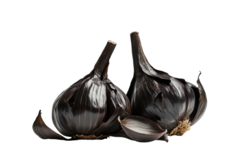 Two black garlic bulbs with stems isolated on transparent background. Black garlic bulbs isolated on white background.