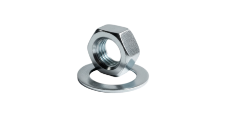 Metal nut sits atop a flat washer in a dark setting. - high quality Metal nut sits atop a flat washer in a dark setting.