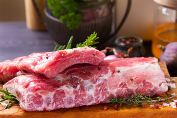 Raw pork ribs with herbs prepared for cooking. Rack of pork ribs