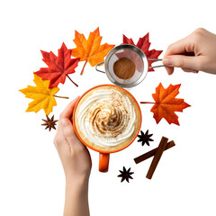 A warm cup of coffee topped with cream and cinnamon, surrounded by colorful autumn leaves and cinnamon sticks. Isolated on a transparent background.