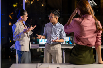 Asian business colleagues experiencing conflict, stress, and argument in office