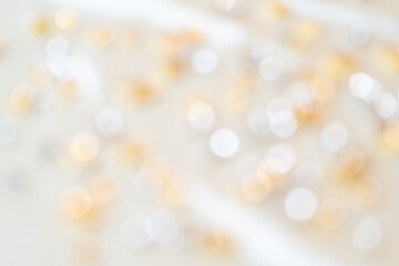 白とゴールドのキラキラしたぼかし背景
