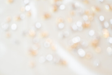 白とゴールドのキラキラしたぼかし背景
