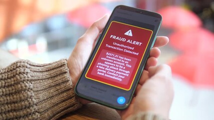 The video shows a realistic online shopping scenario turning into a security alert, as hands follow a payment link that triggers a banking fraud notification. Essential for digital safety tutorials - Powered by Adobe