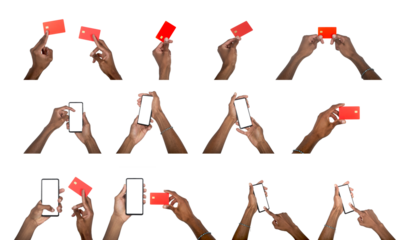 Hand holding smartphone and credit card in finance concept. Black skin male showing digital payment