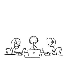 Team of customer support agents working together at desks with laptops  