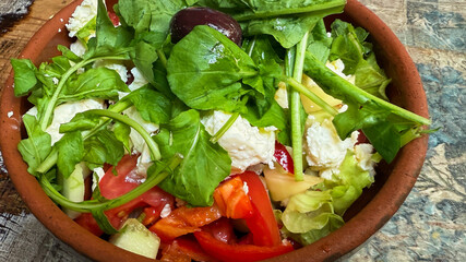 A lush, vibrant Mediterranean salad whispers tales of sun-drenched harvests, fertility festivals, and verdant greengrocers, embodying summer's essence