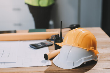Cropped shot two young architects working together on a building construction site.