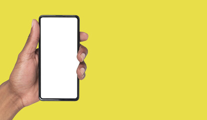 Smartphone held in hand with blank vertical screen for app promotion. Black skin male showing