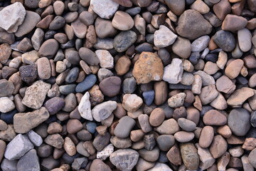 Assortment of Smooth River Rocks and Pebbles stone background