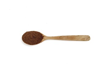 Pile of coffe powder on wooden spoon isolated on white background. Flat lay 