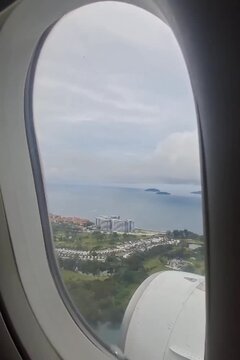 City coastline seen through airplane window view.