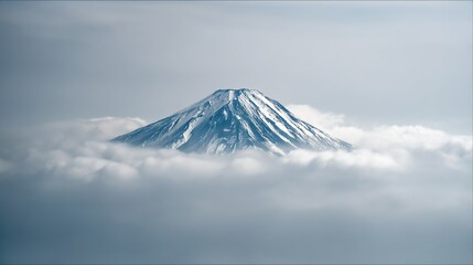 Majestic mountain peaks shrouded in a light mist, with lush green hills. A breathtaking scene showcasing the height of the mountains and the distant scenery.