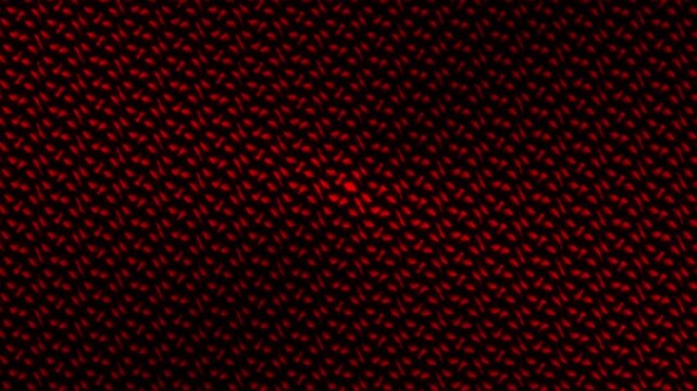 Red glowing geometric pattern with repeating abstract texture and dark futuristic design background