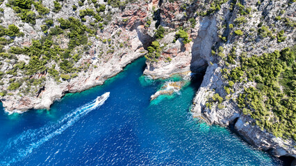 Aerial drone photo of famous steep rocky white cliffs creating beautiful coves and turquiose sea...