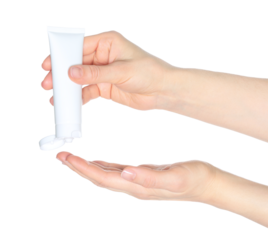 Female hands squeezing cosmetic cream from a tube on transparent background